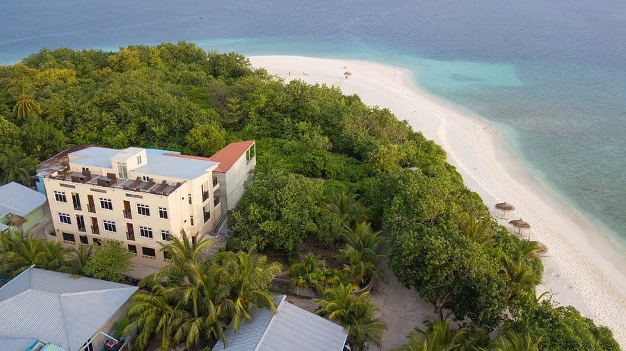 guesthouse viewed from above, surrounded by ocean